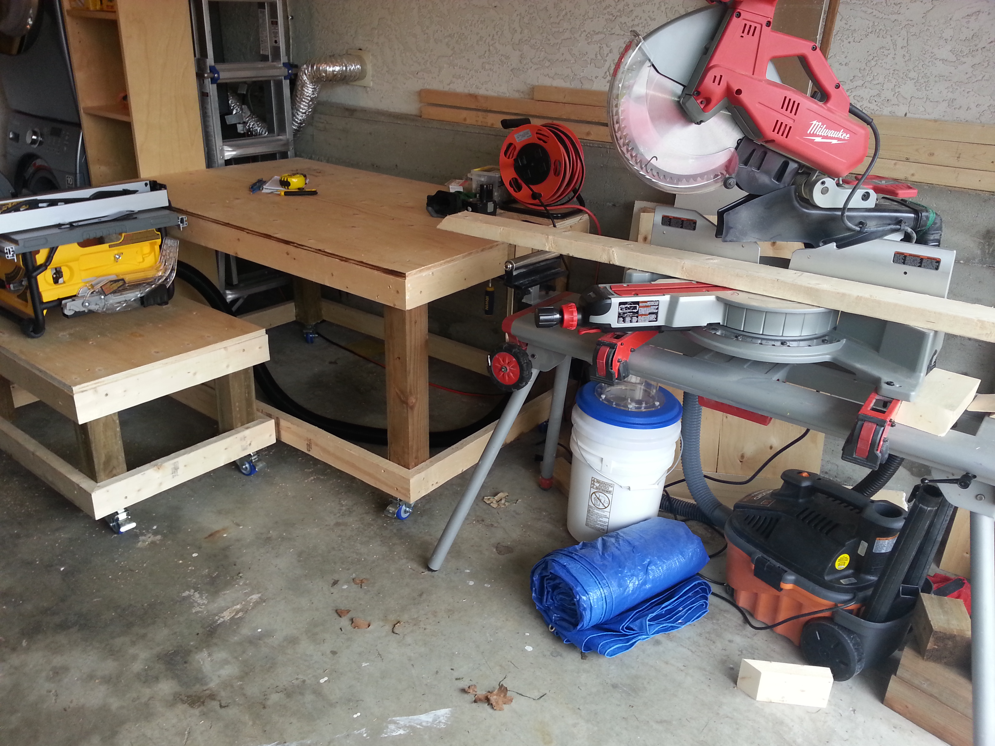 I made the work benches with casters on them so I can pull them out and position them for better space.